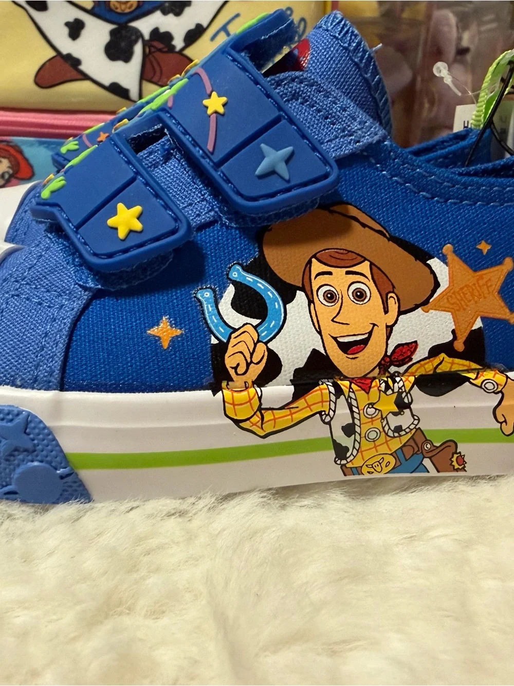 These Disney Toy Story Alien toddler shoes feature a blue canvas design with rub